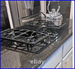 GE Profile 30 gas cooktop with downdraft in black 4-burners