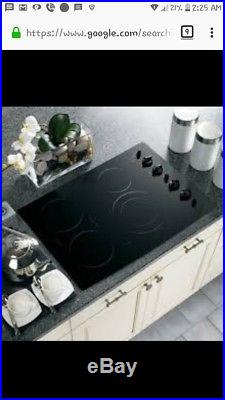 GE Profile 30 in. Black Built-In Knob Ctrl Electric Induction Cooktop