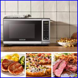 Horno microondasdigital con plato giratorio y puerta con botón pulsador 0,7Cu. Ft Horno microondasdigital con plato giratorio y puerta con botón pulsador 0,7Cu. Ft