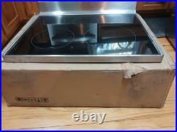 LG cooktop electric- part # AGU76970501 Stainless Steel- open box small dent